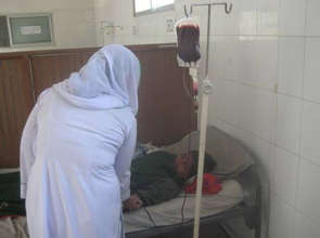 Nurse with patient receiving bld transfusions