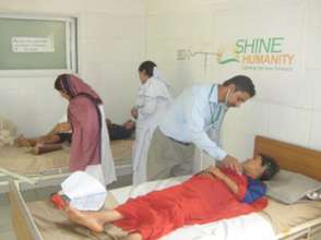 Staff providing care to Shams and Najma