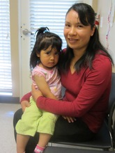 Gabriela smiles with her daughter