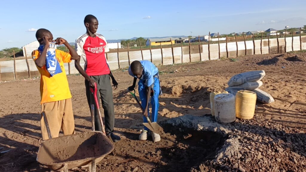 Learners mixing cement