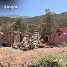 Temporary shelter by a collapsed home, Imedgal