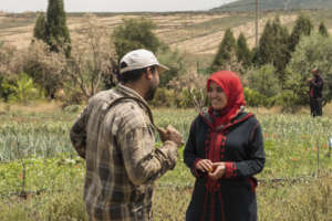 Jamila speaks animatedly with Abdelmalek.