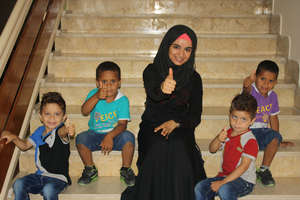 Volunteer Asmaa and the boys give a big thumbs up!