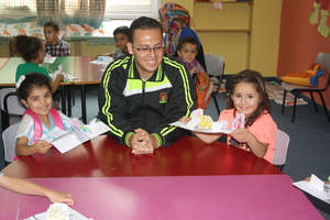 Volunteer Ramsis is proud of his kids' projects