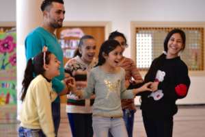 Students and a volunteer enjoying English class.