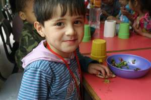 A Child in the Center Receives a Healthy Snack