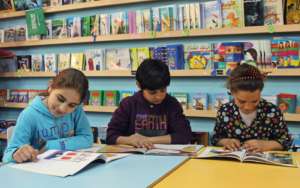 Mariam, Abdul Aziz & Shahd read in the TYO library