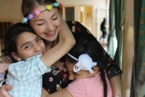 Elisa's students shower her with hugs