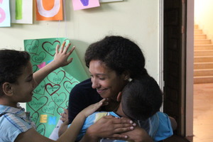Intern Darializa hugs one of her students goodbye