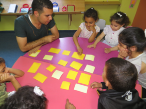 A volunteer helps encourage teamwork