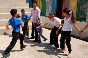 Volunteers and interns race with the kids