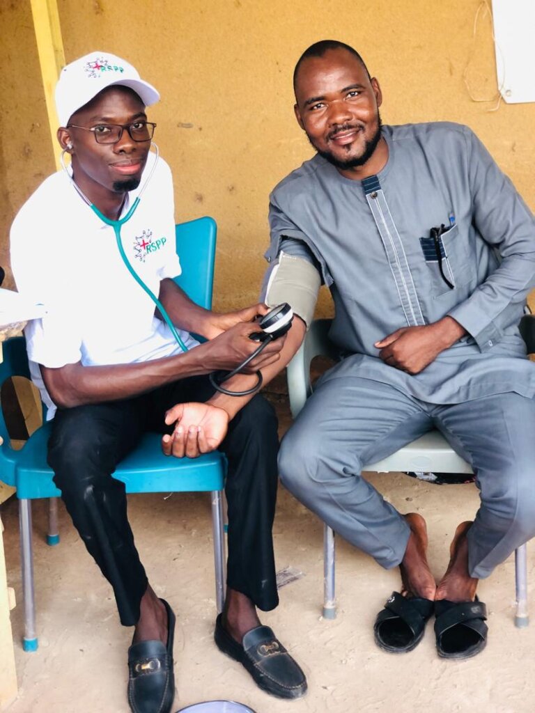 RSPP doctor checking a volunteer blood pressure