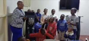 Young ones doing a presentation. A happy lot.