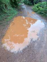 Broken and flooded road