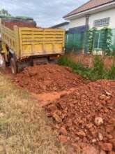 trucks carry read soils and earth to broken parts