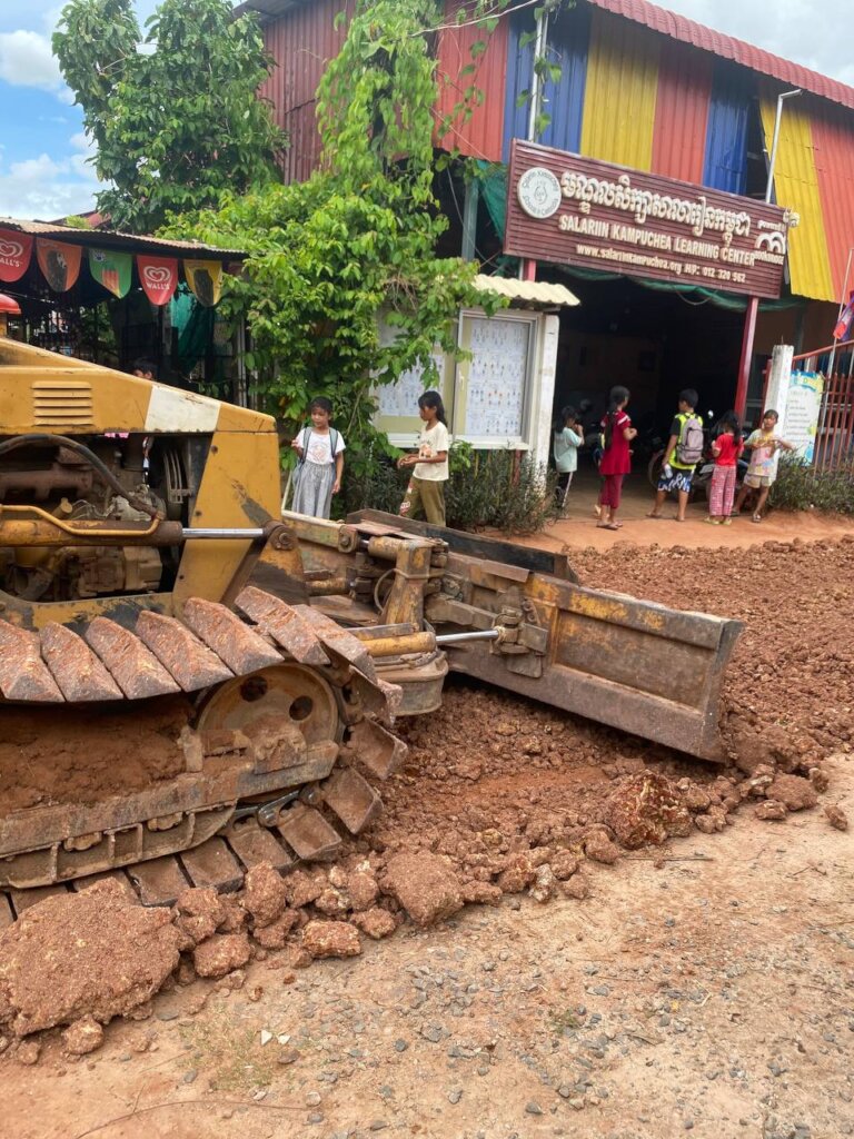 Bulldozer makes smoother path in front of school