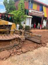 Bulldozer makes smoother path in front of school