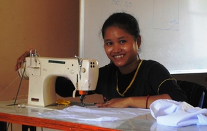 Pou Somphors learning to sew