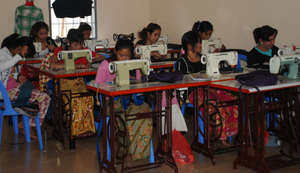 Women Learning to Sew in the SCC Training Room