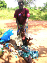 Rhema Braiding a Customer's Hair
