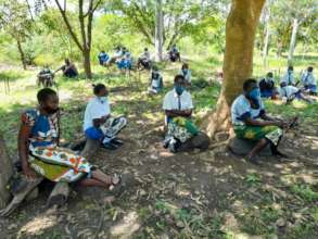 Scholars waiting to receive menstrual supplies
