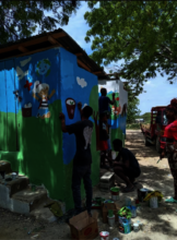 Members of Batey Libertad and volunteers painting