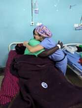 Surgeon hugging a patient after a procedure