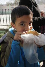 A child enjoys a nutritious snack at school