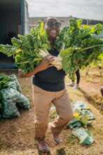 Pumla with spinach from her garden