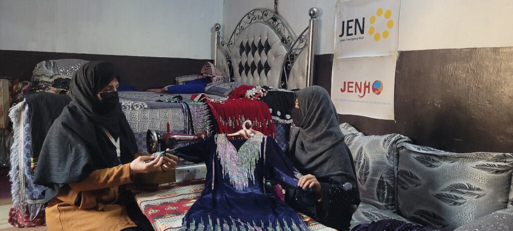 A project participant showing the clothes she made