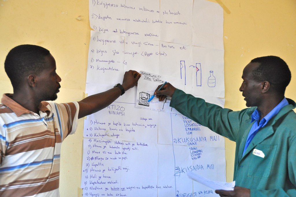 Participant shares his idea for a better cookstove