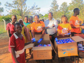 Fellows distributing sanitary kits to girls