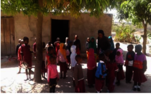 Matron Emerensiana with children at her own house