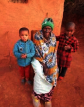 Orphans sister and brother with their grandmother