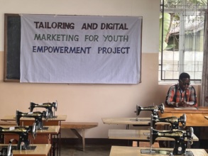 Mr. Omar in classroom waiting for the trainee