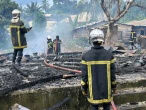 Fire fighters extinguishing the violent inferno