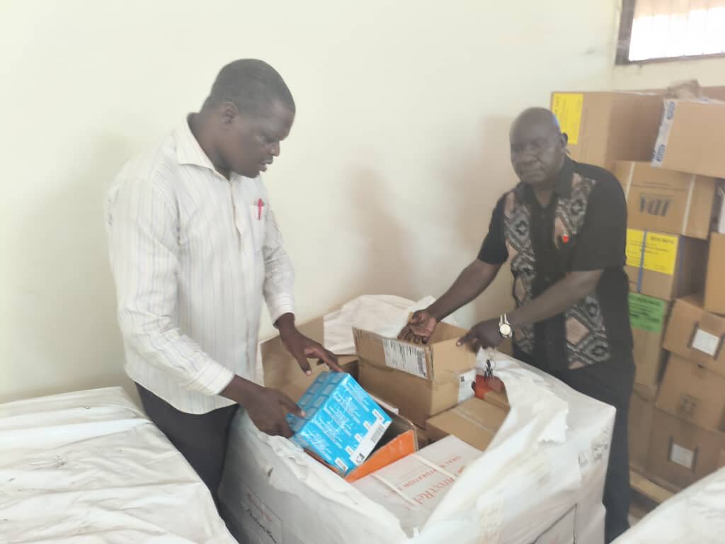 Peace Winds staff inspect supplies