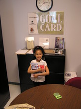 Student proudly holding a redeemed gift