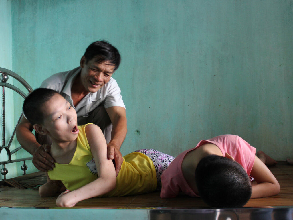 Mr Duc cares for his three paralyzed daughters