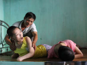 Mr Duc cares for his three paralyzed daughters