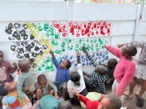 The children's hands making the South African flag