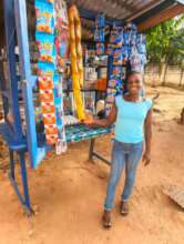 Olivia standing by her table kiosk