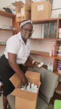 Midwife Christiane stocking up the pharmacy