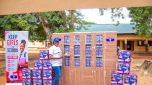 EMCR Founder with items with padbanks for donation