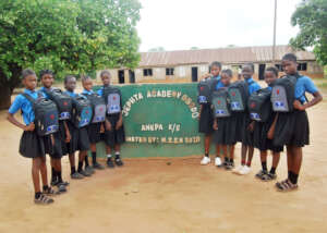 The students posing with their schoolbags.