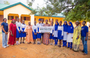 scholarship recipient with school mgt & emcr staff