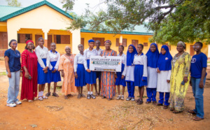 scholarship recipient with school mgt & emcr staff