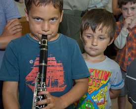 Kids try out instruments at the "Petting Zoo"