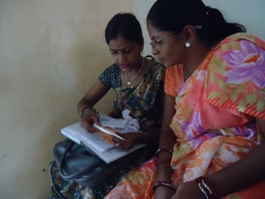 Sundari reviewing protocols with clinic staff