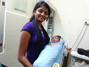 Infant in Embrace at SM Halli